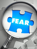 Fear - Missing Puzzle Piece through Magnifier.