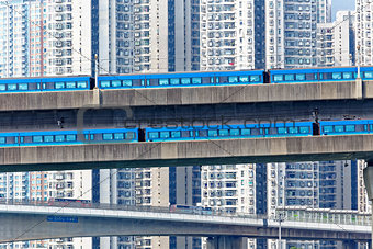 high speed train on bridge in hong kong downtown city