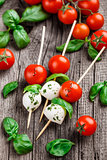Skewers with tomato, basil and mozarella