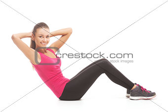 young brunette woman doing press exercises