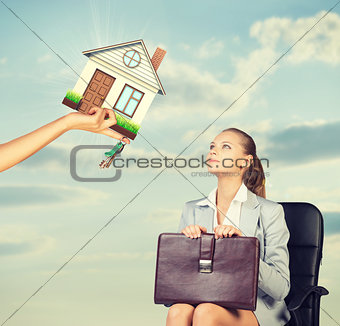 Businesswoman sitting in the chair looking up