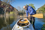 senior paddler and expedition canoe