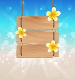 Hanging wooden signboard with tropical flowers frangipani