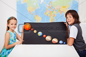 Kids presenting their science home project - the solar system