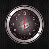 Clock in a speaker on black metallic background
