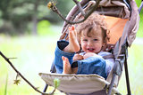 Baby boy in stroller outdoor