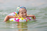 Baby bathing in the sea