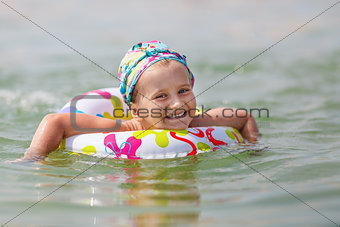 Baby bathing in the sea
