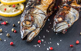 Baked Mackerel Fish with Herbs and Lemon on Stone