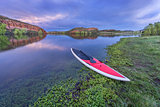 dusk over lake with paddleboard