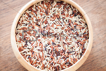 Organic Dry Multi Grain Rice in wooden bowl