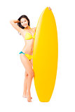 beautiful young Woman  holding surfboard