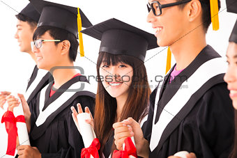 beautiful asian female college graduate at graduation with class