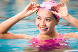  young woman close up portrait in swimming pool