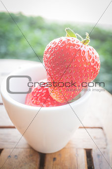 Fresh ripe strawberries on wooden background