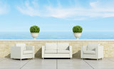 terrace with white sofa and armchairs