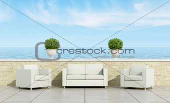 terrace with white sofa and armchairs