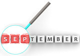 September puzzle with magnifying glass