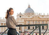 Smiling woman in Vatican City in Rome looking over shoulder