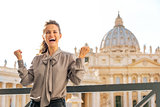 Smiling woman in Vatican City in Rome cheering and laughing