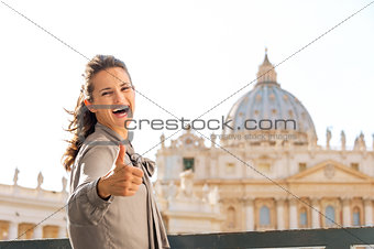 Smiling woman in Vatican City in Rome giving thumbs up
