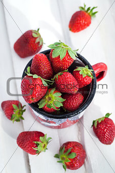 Fresh strawberries  in a tin mug