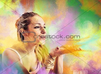 Girl blowing colored powders