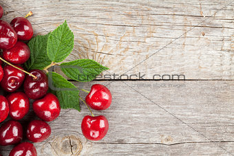 Ripe cherries on wooden table