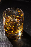 Glass of scotch whiskey with ice