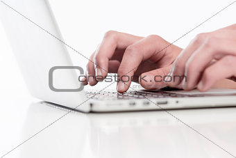 Closeup of Fingers Using Keyboard