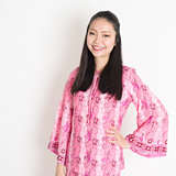 Asian girl in pink batik dress