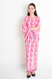Portrait of Asian girl in pink batik dress