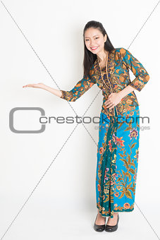 Asian woman hand holding something