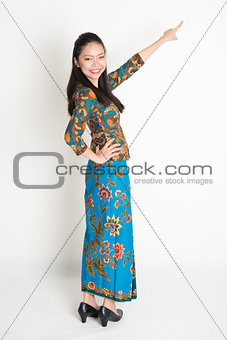 Asian woman pointing