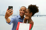 African American Couple Shopping Taking Selfie With Mobile Phone