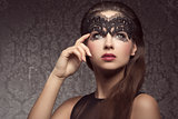 Beautiful brunette with mask