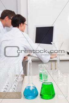 Scientists working attentively with computer