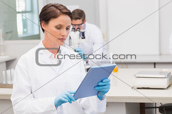 Focus scientist using tablet pc