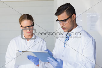 Scientists taking notes