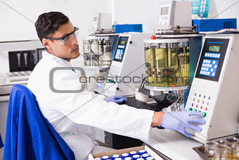 Concentrated scientist working with computer