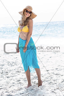 Smiling pretty blonde posing with sarong