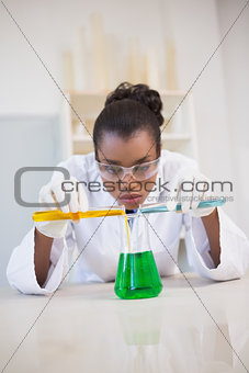 Concentrated scientist doing scientific experiment