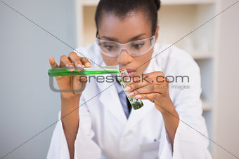 Concentrated scientist doing scientific experiment