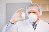 Food scientist holding an egg