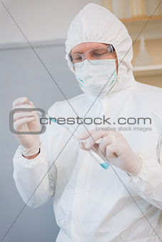 Scientist injecting tube