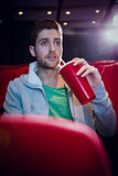 Young man watching a film