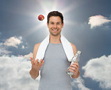 Composite image of smiling fit young man with apple and water bottle
