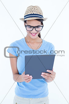 Smiling woman using her tablet