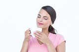 Beautiful woman smelling her coffee