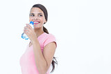 Happy woman drinking bottle of water
